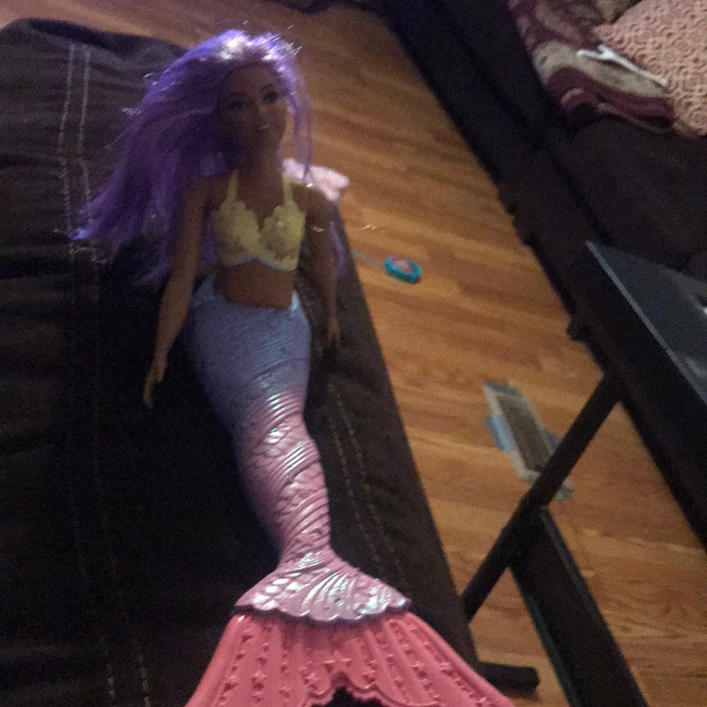 A mermaid and a toy kitchen